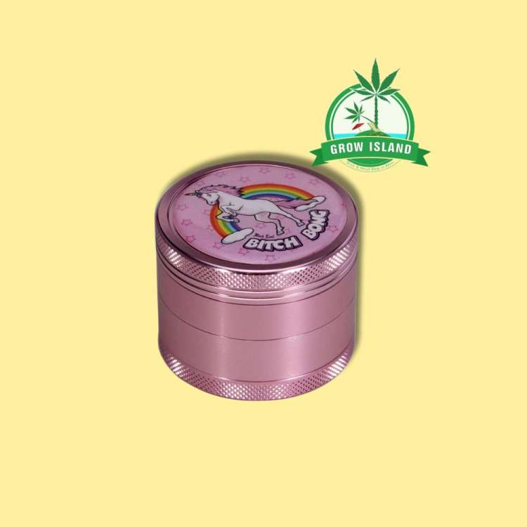 Pink Black Leaf Grinder with a unicorn and Bitch Bong text on it, with yellow background and green grow island logo in the right upper corner