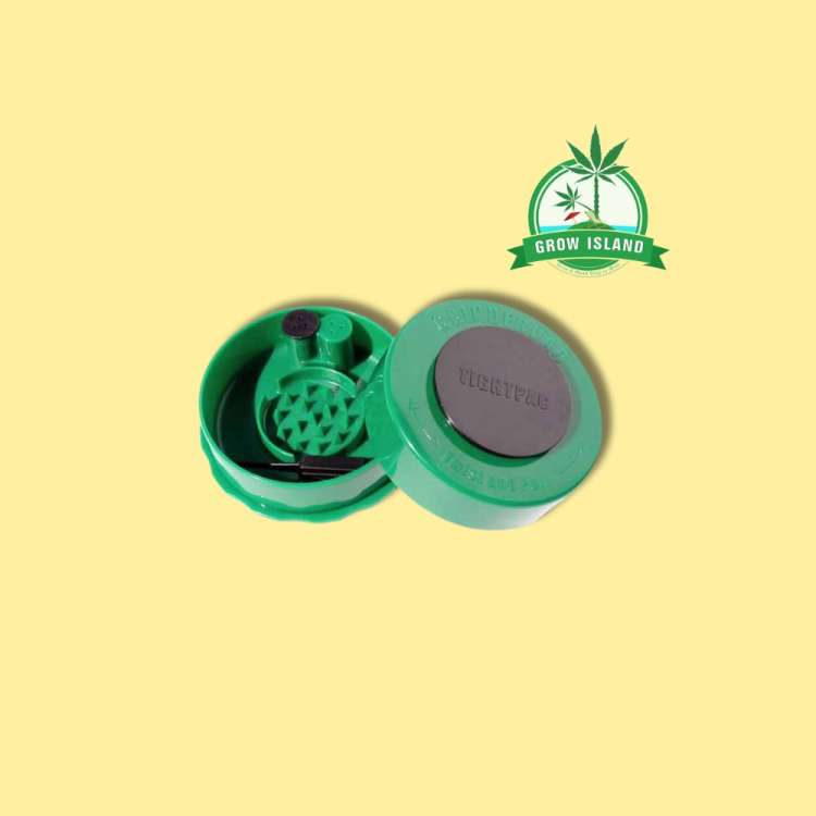 one opened green grinder from GrinderVac with yellow background and green Grow Island logo in the right upper corner