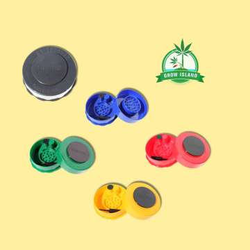 five grinder from GrinderVac, one black is closed, the others are opened, there is one blue, one pink, one yellow and one green with yellow background and green Grow Island logo in the right upper corner