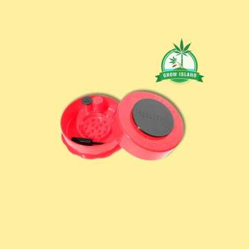 one opened pink grinder from GrinderVac with yellow background and green Grow Island logo in the right upper corner