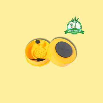 one opened yellow grinder from GrinderVac with yellow background and green Grow Island logo in the right upper corner